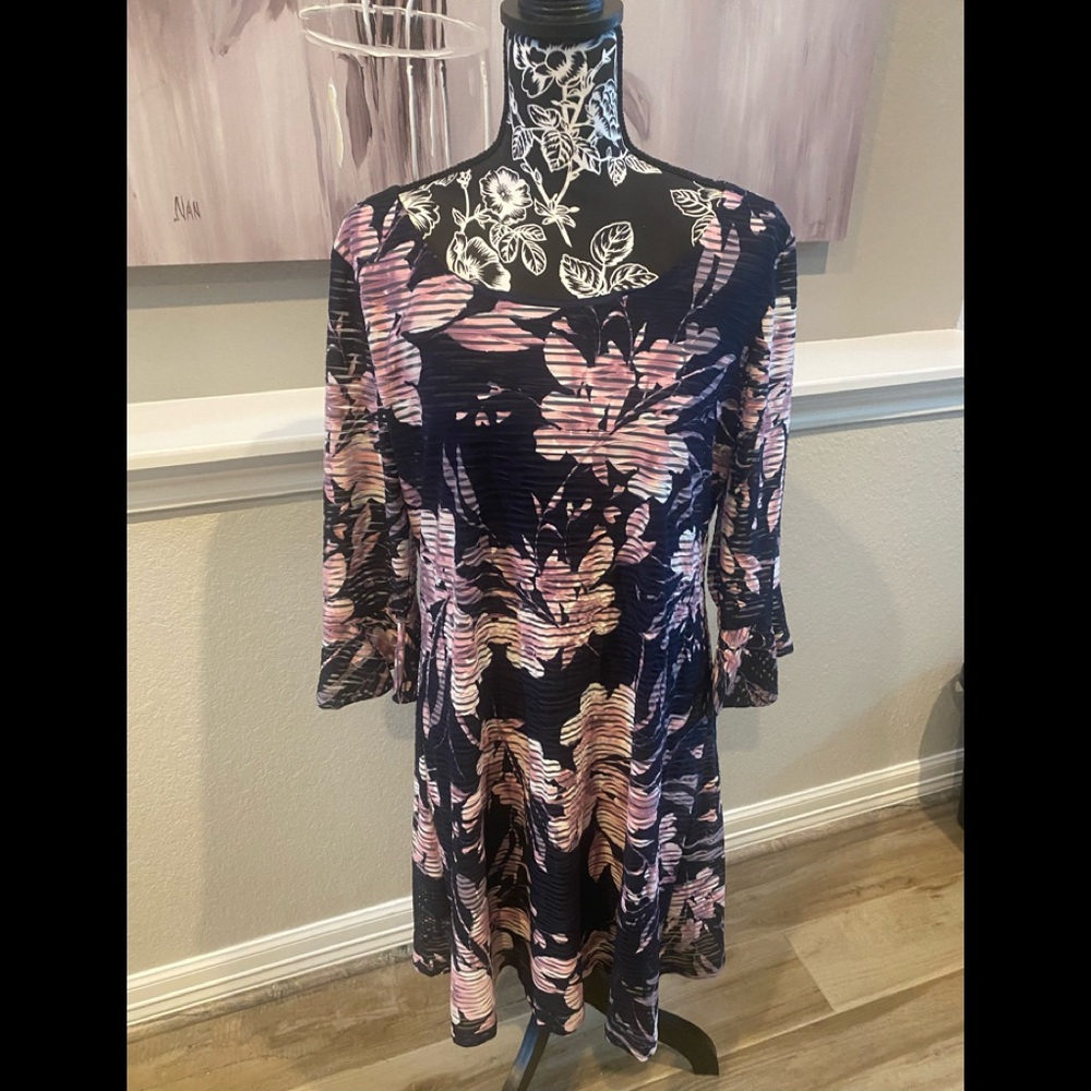 Lovely navy and pink dress, Super stretch very flattering fit. Sheer sleeves